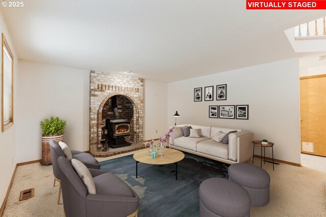 20916 SW Siletz Ct, Tualatin, OR 97062 - living room with a wood stove, carpet flooring, and a skylight