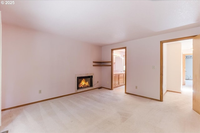 20916 SW Siletz Ct, Tualatin, OR 97062 - unfurnished living room with light colored carpet and a warm lit fireplace