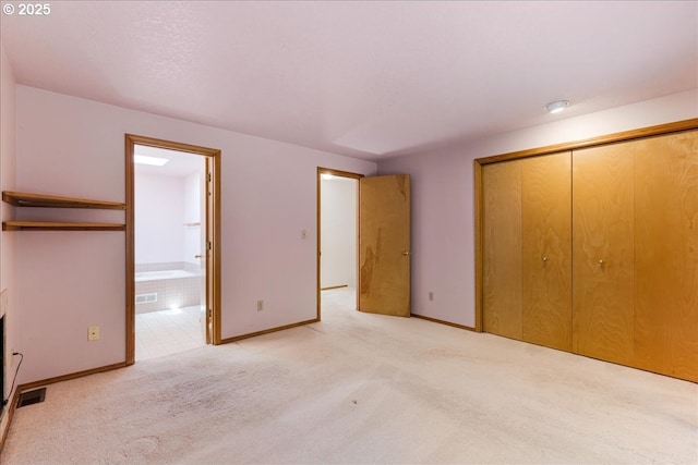 20916 SW Siletz Ct, Tualatin, OR 97062 - unfurnished bedroom featuring a closet, carpet flooring, and ensuite bath