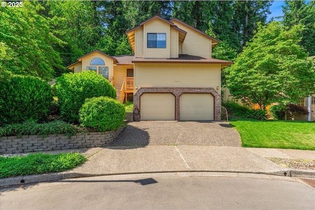 20916 SW Siletz Ct, Tualatin, OR 97062 - tri-level home featuring brick siding, an attached garage, and concrete driveway