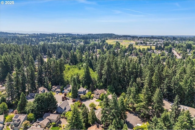 20916 SW Siletz Ct, Tualatin, OR 97062 - aerial view of property and surrounding area with a forest and nearby suburban area