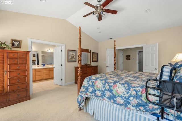 bedroom with baseboards, a ceiling fan, ensuite bath, light carpet, and lofted ceiling