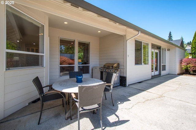 view of patio / terrace with outdoor dining space and a grill