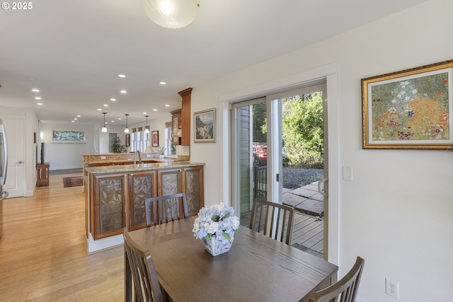 dining space featuring light hardwood / wood-style flooring