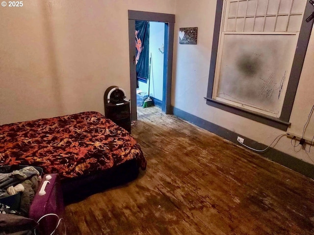 bedroom featuring hardwood / wood-style flooring