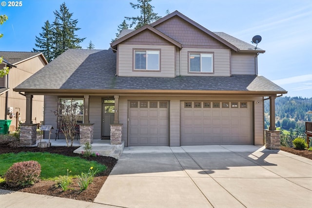 craftsman-style house with a porch, roof with shingles, a garage, and concrete driveway