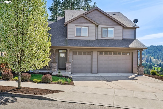 craftsman-style home with roof with shingles, driveway, stone siding, and an attached garage