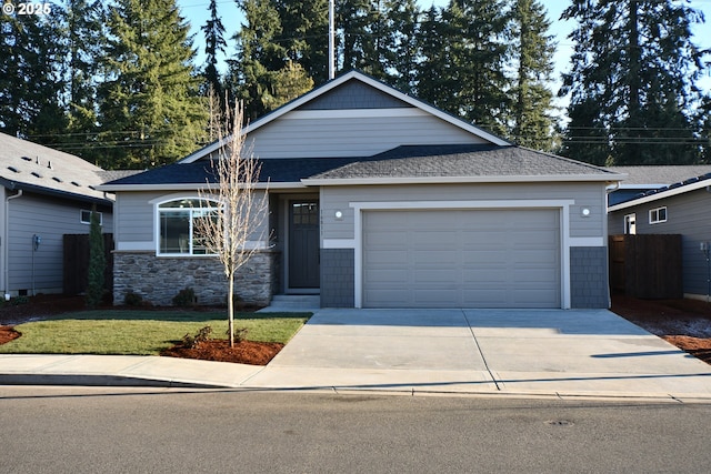 view of front of home with a garage and a front yard