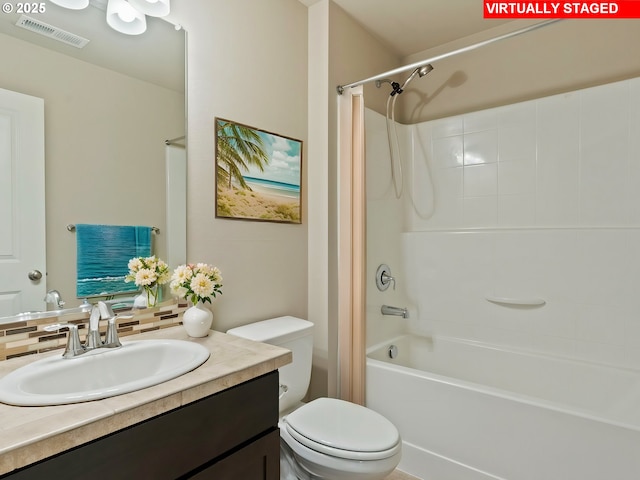 full bathroom with vanity, backsplash, toilet, and washtub / shower combination