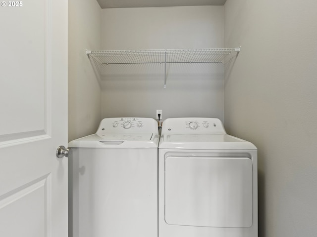 washroom featuring washer and dryer