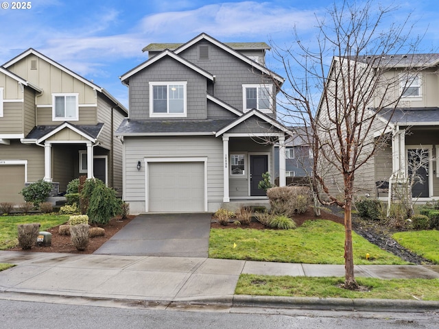 craftsman-style house with a garage and a front lawn