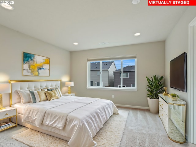 bedroom with light colored carpet