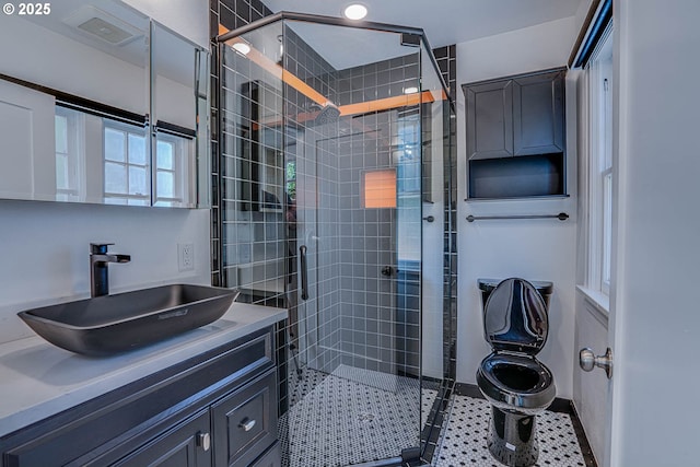 bathroom with vanity and an enclosed shower