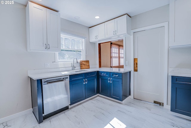 kitchen with white cabinetry, blue cabinets, dishwasher, and sink