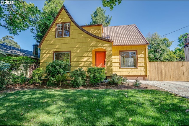 tudor house with a front yard