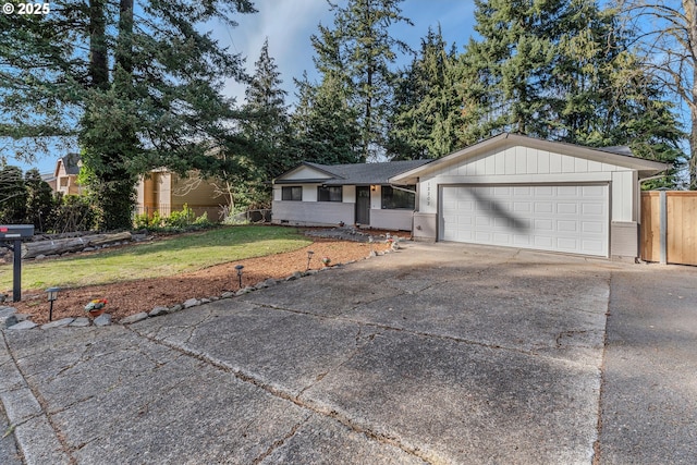 single story home with brick siding, a front yard, fence, a garage, and driveway