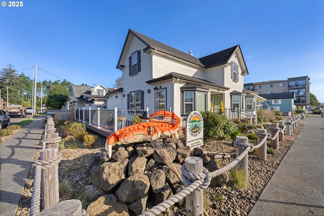 view of property exterior with a wooden deck