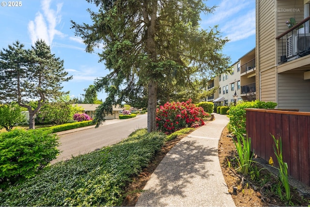 view of home's community with fence and a residential view