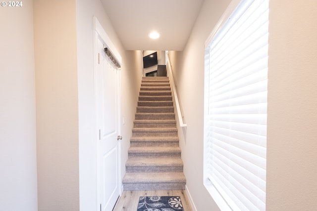 staircase featuring hardwood / wood-style flooring