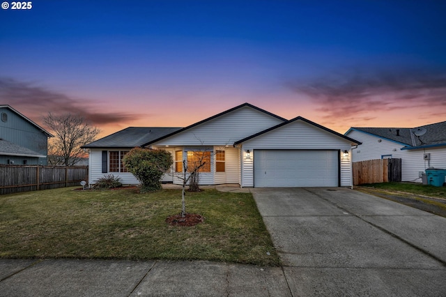 ranch-style house with a yard and a garage