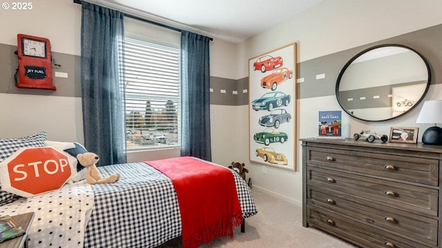 carpeted bedroom featuring baseboards
