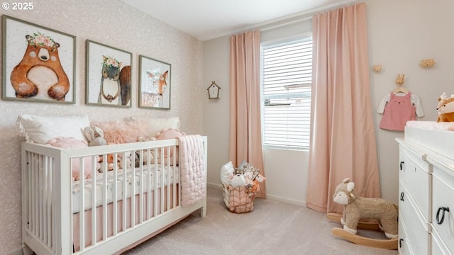 carpeted bedroom with a nursery area and multiple windows