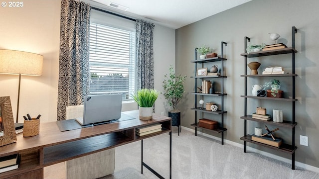 carpeted office featuring baseboards