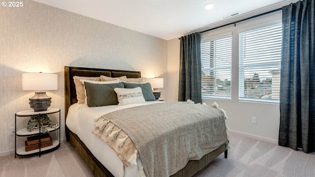 bedroom with carpet flooring and baseboards