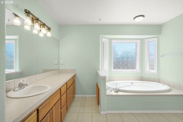 1255 NE 17th Ave, Hillsboro, OR 97124 - bathroom featuring healthy amount of natural light, vanity, a garden tub, and tile patterned flooring