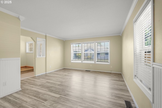 1255 NE 17th Ave, Hillsboro, OR 97124 - spare room with light wood-style floors and crown molding