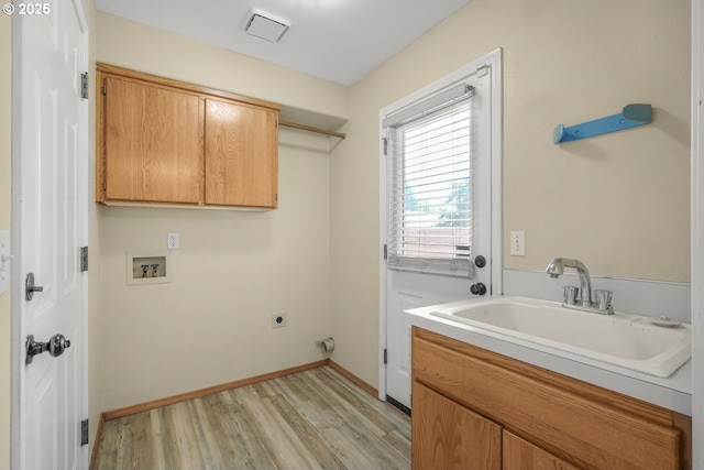 1255 NE 17th Ave, Hillsboro, OR 97124 - laundry area with cabinet space, electric dryer hookup, hookup for a washing machine, and light wood-style floors