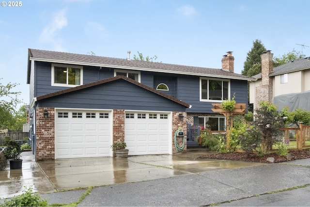 view of front facade featuring a garage, driveway, brick siding, and a chimney