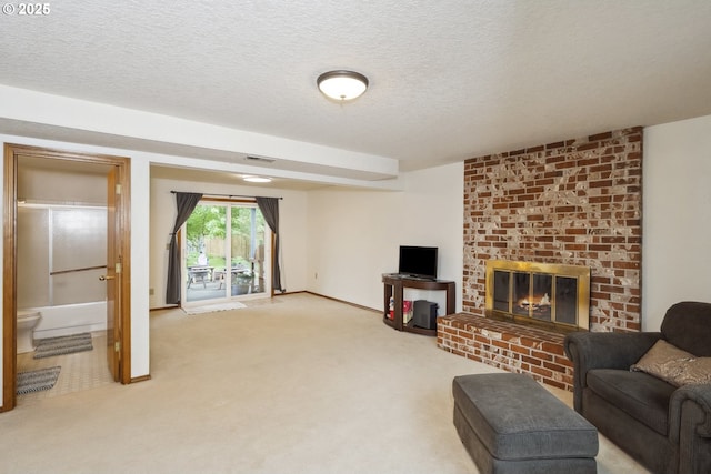 carpeted living area featuring a brick fireplace, a textured ceiling, and baseboards