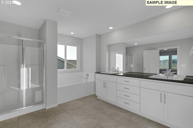 full bath with recessed lighting, a sink, a shower stall, a bath, and double vanity