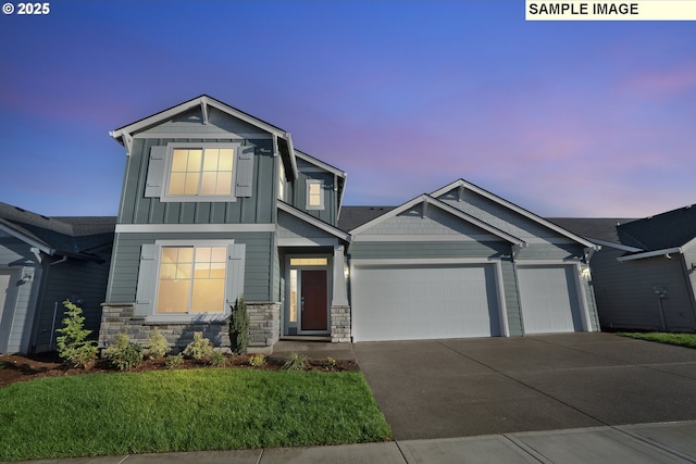 view of front facade featuring driveway, stone siding, an attached garage, board and batten siding, and a front yard