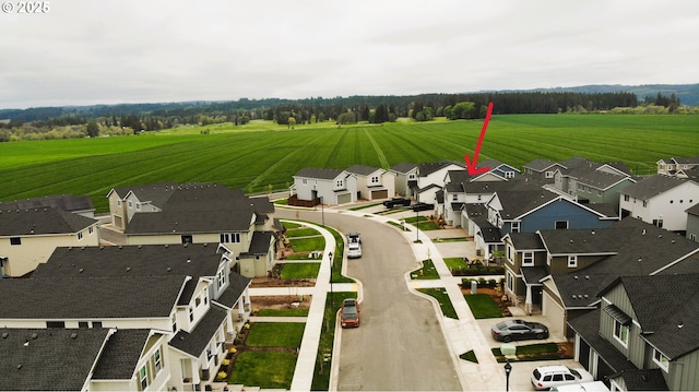 birds eye view of property with a residential view