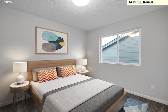 carpeted bedroom with a textured ceiling and baseboards