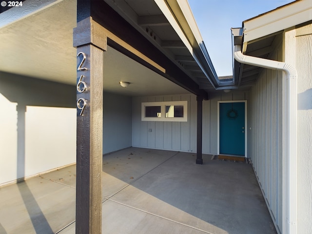 entrance to property featuring a patio