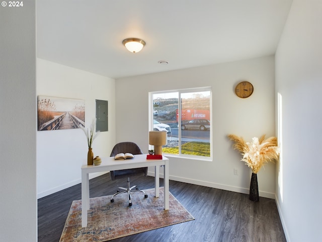 home office with electric panel, baseboards, and wood finished floors