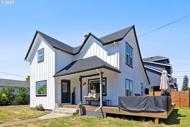 8007 N Hudson St, Portland, OR 97203 - modern inspired farmhouse with roof with shingles, board and batten siding, covered porch, and a chimney