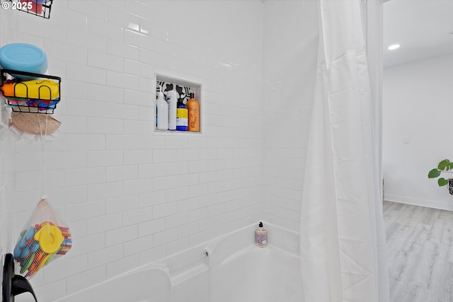 8007 N Hudson St, Portland, OR 97203 - bathroom featuring shower / tub combo and wood finished floors