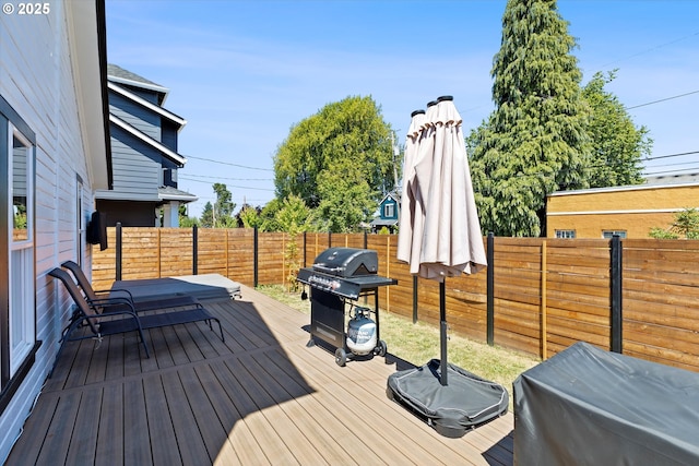 8007 N Hudson St, Portland, OR 97203 - wooden deck with grilling area and a fenced backyard