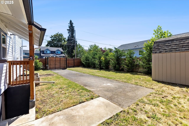 8007 N Hudson St, Portland, OR 97203 - view of yard featuring a storage shed and a gate
