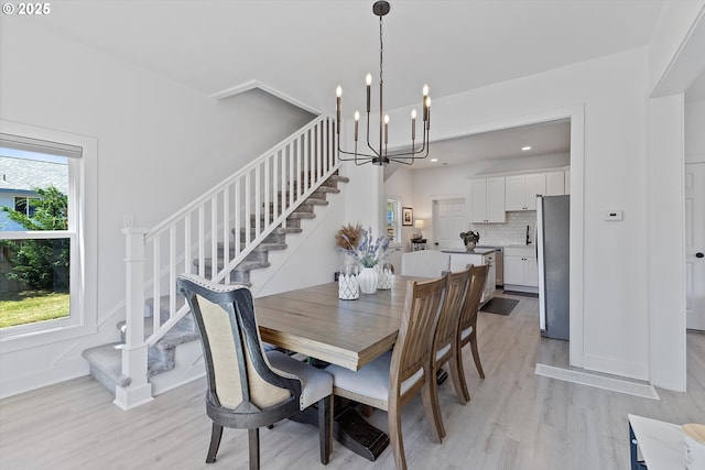 8007 N Hudson St, Portland, OR 97203 - dining area featuring stairs, a chandelier, light wood-style flooring, and recessed lighting