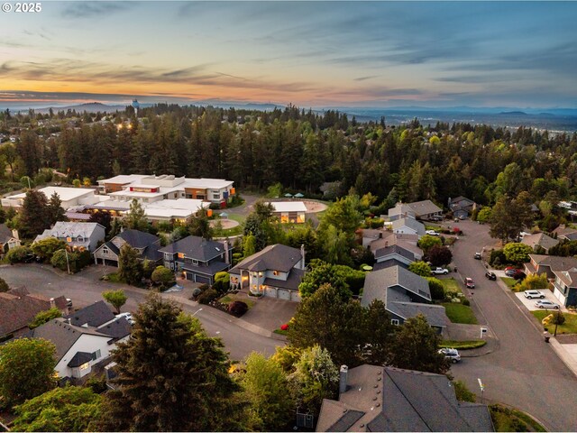 aerial view at dusk of a residential view and a water view