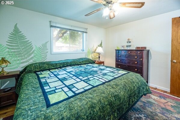 855 E 39th Ave, Eugene, OR 97405 - bedroom featuring wood finished floors, ceiling fan, and baseboards