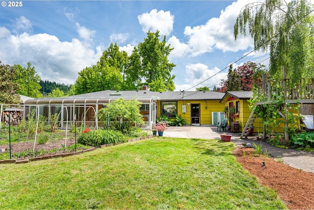 855 E 39th Ave, Eugene, OR 97405 - back of property with a patio, a lawn, and a chimney