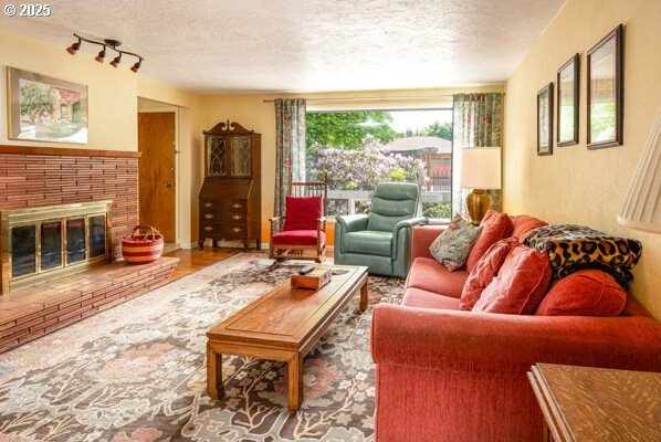 855 E 39th Ave, Eugene, OR 97405 - living area with a textured ceiling and a fireplace
