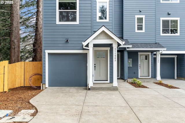 21190 SW Ortiz Ln, Beaverton, OR 97003 - view of front of property featuring a garage, concrete driveway, and fence