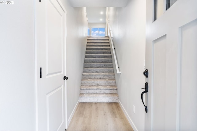 21190 SW Ortiz Ln, Beaverton, OR 97003 - staircase featuring baseboards, wood finished floors, and recessed lighting
